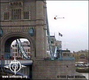 Bond crew chopper flies by Tower Bridge