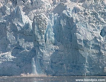 Calving ice falls from the Hubbard Glacier in Yakutat bay, Alaska