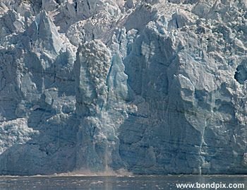 Calving ice falls from the Hubbard Glacier in Yakutat bay, Alaska