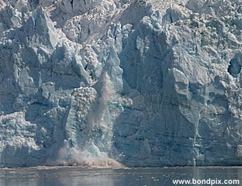 Calving ice falls from the Hubbard Glacier in Yakutat bay, Alaska