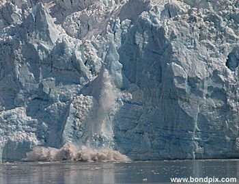 Calving ice falls from the Hubbard Glacier in Yakutat bay, Alaska