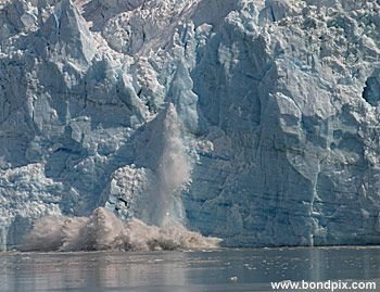 Calving ice falls from the Hubbard Glacier in Yakutat bay, Alaska