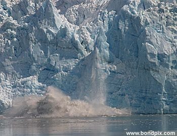 Calving ice falls from the Hubbard Glacier in Yakutat bay, Alaska