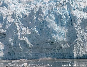 Calving ice falls from the Hubbard Glacier in Yakutat bay, Alaska