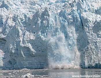 Calving ice falls from the Hubbard Glacier in Yakutat bay, Alaska