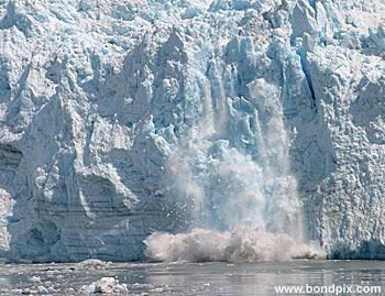 Calving ice falls from the Hubbard Glacier in Yakutat bay, Alaska