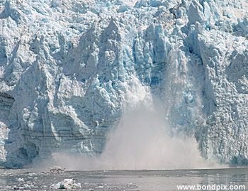 Calving ice falls from the Hubbard Glacier in Yakutat bay, Alaska