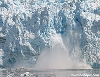 Calving ice falls from the Hubbard Glacier in Yakutat bay, Alaska