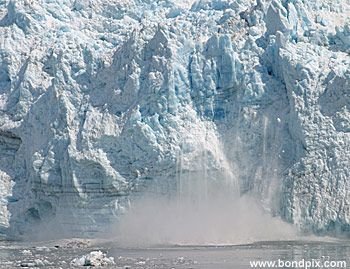 Calving ice falls from the Hubbard Glacier in Yakutat bay, Alaska