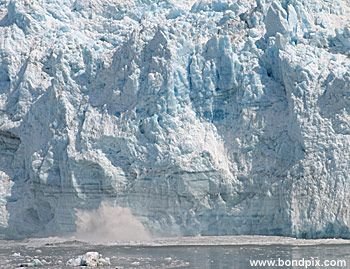 Calving ice falls from the Hubbard Glacier in Yakutat bay, Alaska