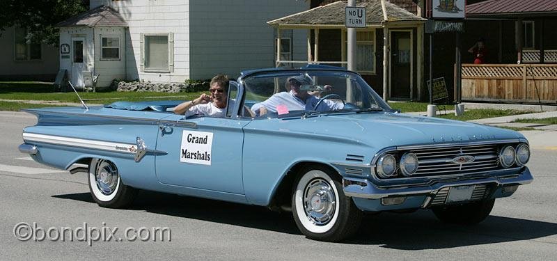 Deer-Lodge-Parade_14668.jpg - Grand Marshals Sherm and Bonnie Anderson drive their Chevy Impala along Main Street during the Territorial Days Parade in Deer Lodge Montana, June 14th 2008