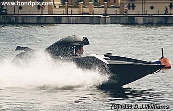 On location with the action unit for the James Bond 007 film 'The World is not Enough'. An exciting boat chase filmed on the River Thames in London