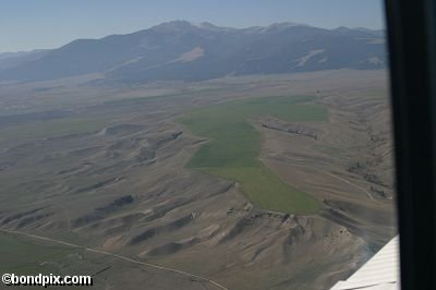 Aerial views over the Deer Lodge valley, Deer Lodge, Anaconda and Butte in Montana