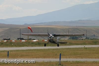 Taxiing past the wind sock at the annual fly in at Pogreba Field, Three Forks, Montana