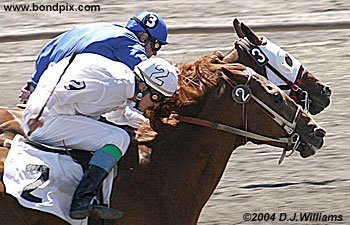 Race horse RJ Red Racer riden by Joe Holmes beats Masked Huichol riden by Terrance Birdrattler